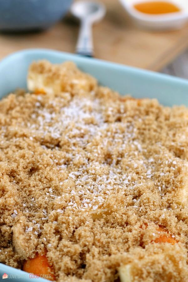 Learn how to make candied yams for your next family meal, it's so simple! This candied sweet potatoes recipe is easy and delicious! Here we see more seasonings being added to the candied sweet potatoes recipe.