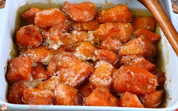 Learn how to make candied yams for your next family meal, it's so simple! This candied sweet potatoes recipe is easy and delicious! A horizontal view of the finished how to make candied yams tutorial.