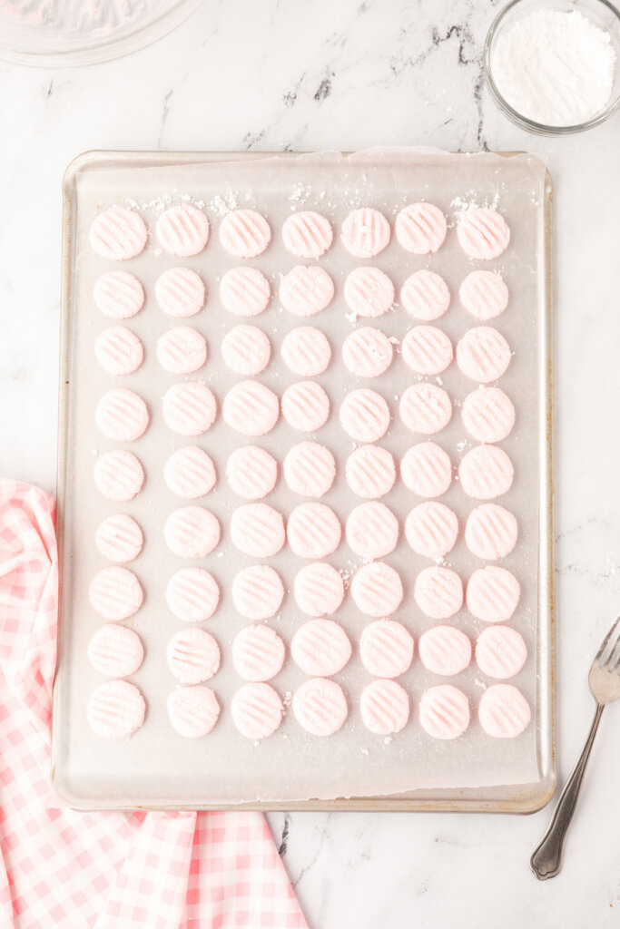 cream cheese mints drying on a baking sheet